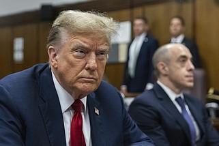 FILE - Former President Donald Trump attends jury selection at Manhattan criminal court in New York, April 15, 2024. Trump's criminal hush money trial involves allegations that he falsified his company's records to hide the true nature of payments to his former lawyer Michael Cohen, who helped bury negative stories about him during the 2016 presidential campaign. He's pleaded not guilty. (Jeenah Moon/Pool Photo via AP, File)